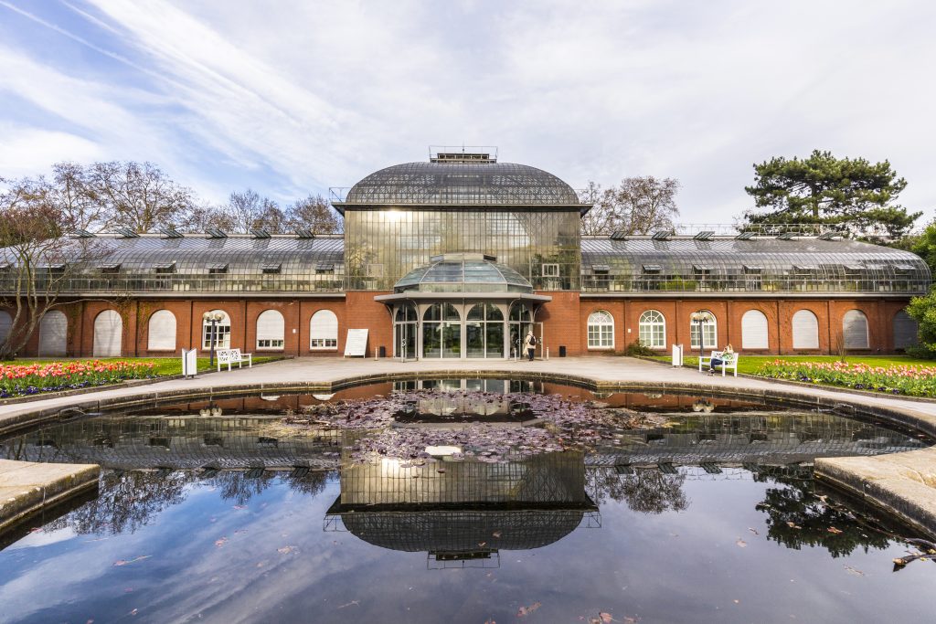 entrance building of the palmengarten in Frankfurt, Germany. The Palmengarten is one of two botanical gardens in Frankfurt and the largest garden of its kind in Germany - frankfurt